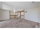 Carpeted loft area with railing that overlooks the lower level at 532 Greenbriar Pl, Boulder City, NV 89005