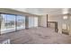 Bright loft area with a sliding glass door and a view of the neighborhood at 532 Greenbriar Pl, Boulder City, NV 89005