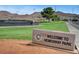 The 'Welcome to Hemenway Park' sign with a tennis court and mountains in the background at 532 Greenbriar Pl, Boulder City, NV 89005
