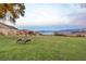 Beautiful view of mountain and lake with a Gathering of Big Horn Sheep grazing on the green grass at 532 Greenbriar Pl, Boulder City, NV 89005
