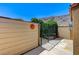 Enclosed private patio with a black metal gate and mountain views at 532 Greenbriar Pl, Boulder City, NV 89005