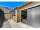 Exterior view of an enclosed patio with a sliding glass door at 532 Greenbriar Pl, Boulder City, NV 89005