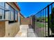 Exterior view of an enclosed private patio with a black metal gate at 532 Greenbriar Pl, Boulder City, NV 89005