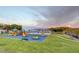 Enjoy the outdoors at this playground with slides, swings, and climbing structures with a beautiful view of the mountains at 532 Greenbriar Pl, Boulder City, NV 89005