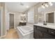Bathroom with soaking tub, double vanity, and separate shower at 5695 Merced St, Las Vegas, NV 89148