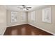 Inviting bedroom featuring beautiful hardwood floors, plantation shutters and fresh neutral paint at 5695 Merced St, Las Vegas, NV 89148