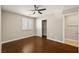 Cozy bedroom featuring hardwood floors, a ceiling fan, and a closet for storage at 5695 Merced St, Las Vegas, NV 89148