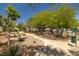Lush community park with mature trees, walking paths, and well-maintained landscaping at 5695 Merced St, Las Vegas, NV 89148