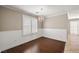 Cozy dining room featuring hardwood floors, wainscoting, plantation shutters and contemporary light fixture at 5695 Merced St, Las Vegas, NV 89148