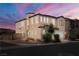 Two-story home on a corner lot featuring a two-car garage and attractive landscaping with easy access to roads at 5695 Merced St, Las Vegas, NV 89148