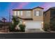Charming two-story home with a well-manicured front yard and attached two-car garage in a desirable neighborhood at 5695 Merced St, Las Vegas, NV 89148