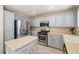 Stylish kitchen featuring stainless steel appliances, updated cabinets, and tile backsplash at 5695 Merced St, Las Vegas, NV 89148