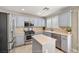 Charming kitchen featuring updated cabinets, stainless steel appliances, and a functional center island at 5695 Merced St, Las Vegas, NV 89148