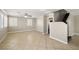 Spacious living room with tile floors, ceiling fan, neutral paint and staircase leading to the second floor at 5695 Merced St, Las Vegas, NV 89148