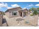 Low-maintenance backyard with covered patio creates an ideal space for outdoor living and entertaining at 6039 Tokara Ave, Las Vegas, NV 89122