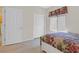 Bedroom with wood floors, neutral walls, and closet doors at 6039 Tokara Ave, Las Vegas, NV 89122