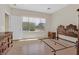 Spacious bedroom with lots of natural light, wood floors, and furniture set at 6039 Tokara Ave, Las Vegas, NV 89122