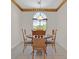 Inviting breakfast nook featuring an arched window and a classic chandelier at 6039 Tokara Ave, Las Vegas, NV 89122