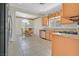 Cozy kitchen featuring wood cabinetry, stainless appliances, granite countertops and a breakfast nook at 6039 Tokara Ave, Las Vegas, NV 89122
