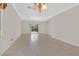 Bright living room with tile flooring, natural light, neutral paint and access to the backyard at 6039 Tokara Ave, Las Vegas, NV 89122