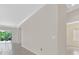 Clean and bright open living space featuring tile flooring, neutral walls and an access to the backyard at 6039 Tokara Ave, Las Vegas, NV 89122