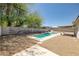 Backyard featuring a sleek pool with a modern water feature at 616 Fernbrook Dr, Henderson, NV 89002