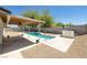 Covered patio overlooks a refreshing in-ground pool and patio area for comfortable outdoor living at 616 Fernbrook Dr, Henderson, NV 89002