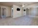 Carpeted bedroom with mirrored closet doors and a ceiling fan at 616 Fernbrook Dr, Henderson, NV 89002