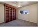 Bedroom featuring a large wooden bookshelf and a window at 616 Fernbrook Dr, Henderson, NV 89002