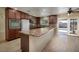 Bright kitchen with a long island and easy access to the backyard pool at 616 Fernbrook Dr, Henderson, NV 89002