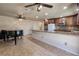 Open floorplan kitchen featuring granite countertops and stainless steel appliances at 616 Fernbrook Dr, Henderson, NV 89002