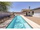 Full view of the backyard with a swimming pool and covered patio at 616 Fernbrook Dr, Henderson, NV 89002