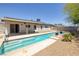 Refreshing backyard pool with sunbathing steps and a covered patio at 616 Fernbrook Dr, Henderson, NV 89002