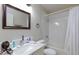 Clean and modern bathroom with updated fixtures, a bathtub with shower, and a mirrored vanity at 6337 Canyon Vista Ct, Las Vegas, NV 89156