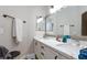 Bright bathroom with double sinks, large vanity, and modern fixtures, providing convenience and style at 6337 Canyon Vista Ct, Las Vegas, NV 89156