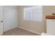 Cozy bedroom featuring a window with blinds and a closet with white sliding doors at 6337 Canyon Vista Ct, Las Vegas, NV 89156