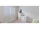 Neutral bedroom with window and blinds, carpet, and white drawer sets at 6337 Canyon Vista Ct, Las Vegas, NV 89156