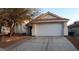 Charming single-story home featuring a two-car garage, desert landscaping and a red tile roof at 6337 Canyon Vista Ct, Las Vegas, NV 89156