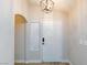 A bright entryway featuring a classic white door with modern hardware, adjacent to a large window letting in natural light at 6337 Canyon Vista Ct, Las Vegas, NV 89156