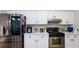 Well-equipped kitchen featuring stainless steel appliances and white cabinets, providing a functional and stylish cooking space at 6337 Canyon Vista Ct, Las Vegas, NV 89156