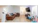 Bright living space with wood-look flooring, neutral walls, and comfortable seating, perfect for relaxation and entertainment at 6337 Canyon Vista Ct, Las Vegas, NV 89156