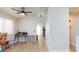 Sunlit living area with wood-look flooring and neutral walls, offering a clean and versatile space for various activities at 6337 Canyon Vista Ct, Las Vegas, NV 89156