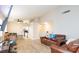 Open-concept living room featuring wood-look floors and ample natural light at 6337 Canyon Vista Ct, Las Vegas, NV 89156