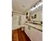 Updated bathroom features granite counters, modern fixtures, and a shower-tub combination, for a spa-like experience at 6699 Oxendale Ave, Las Vegas, NV 89139