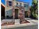 Attractive two-story home with a covered porch, a garage, and xeriscaping for low maintenance and water conservation at 6699 Oxendale Ave, Las Vegas, NV 89139