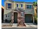 Charming two-story home with a quaint front porch and attached garage, offers curb appeal and convenience at 6699 Oxendale Ave, Las Vegas, NV 89139