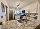 Bright kitchen with stainless steel appliances and granite countertops at 6699 Oxendale Ave, Las Vegas, NV 89139