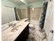 Bright bathroom featuring vanity, tub/shower, and stylish fixtures at 6779 Goose Watch Ct, Las Vegas, NV 89139