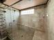 The frameless glass shower features marble surround, a seat, and sleek fixtures at 6779 Goose Watch Ct, Las Vegas, NV 89139