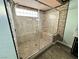 Featuring a clear glass enclosure, the shower includes a seat and modern fixtures at 6779 Goose Watch Ct, Las Vegas, NV 89139